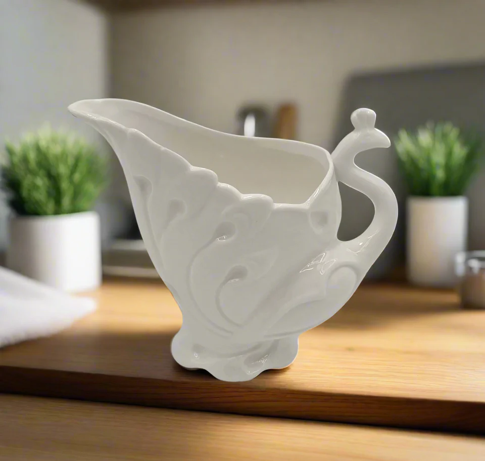 1.99 8OZ PORCELAIN CREAMER-WHITE